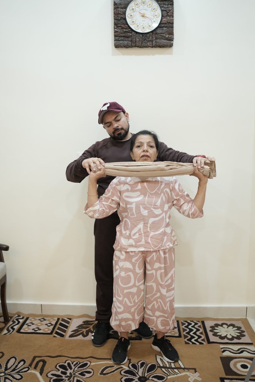 Towel stretch with trainer